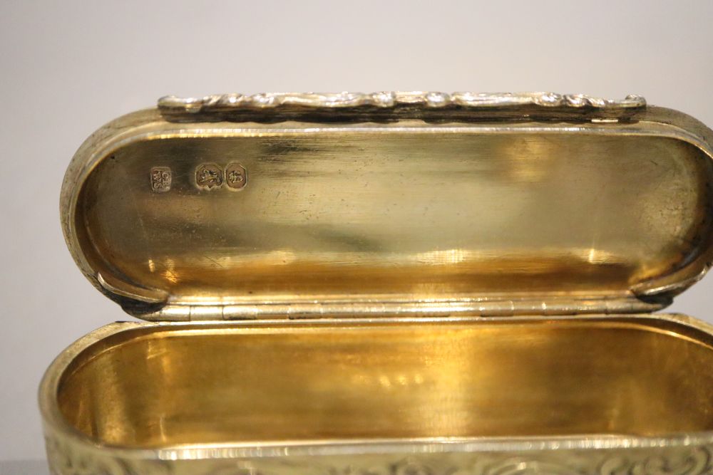 An early Victorian engraved silver gilt oval snuff box, Rawlings & Summers, London, 1837, 98.8 grams.